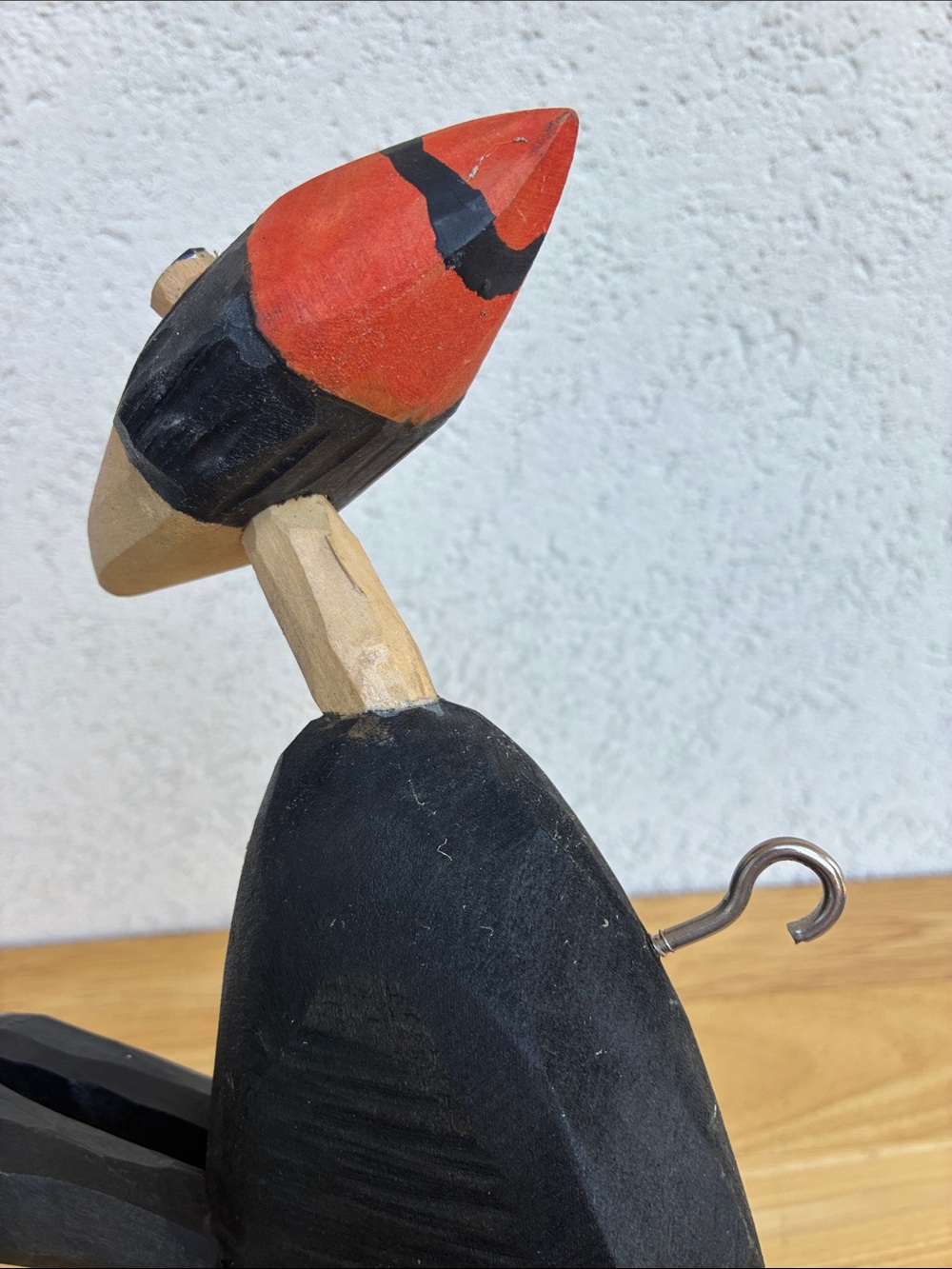 Strange hand carved folk art character with bland and orange clothes and a hook - Picture 11 of 13